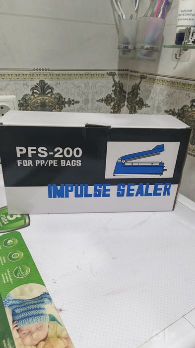 Paket yopishtirish apparati