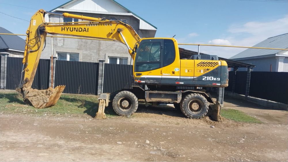 Услуги Колёсного Экскавторора 210w-9