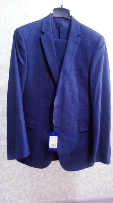 Продам новый костюм с брюками