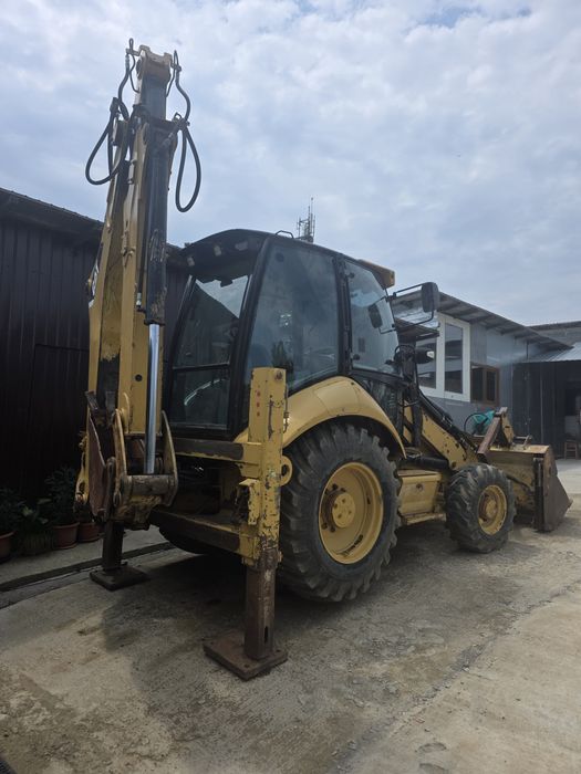 Vand Buldoexcavator Caterpillar