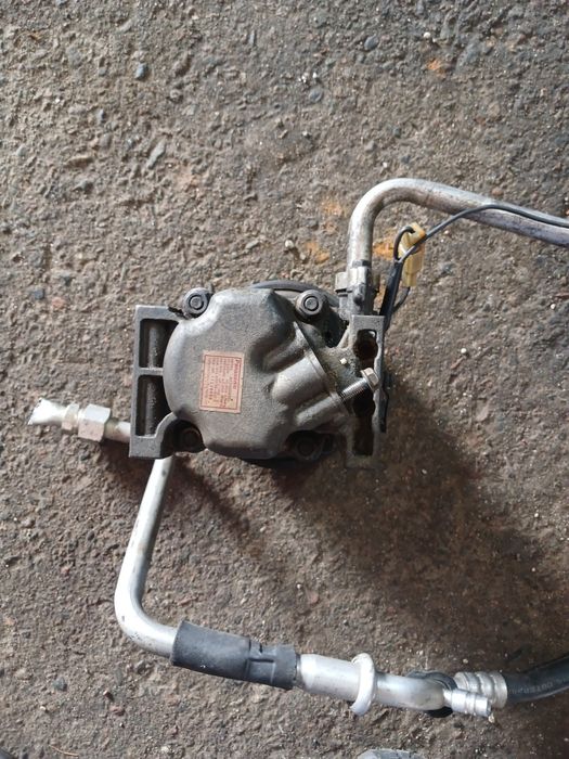 Компрессор кондиционера Мазда 323