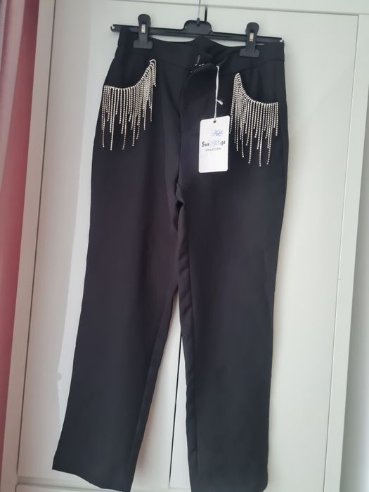 Vand pantaloni eleganti