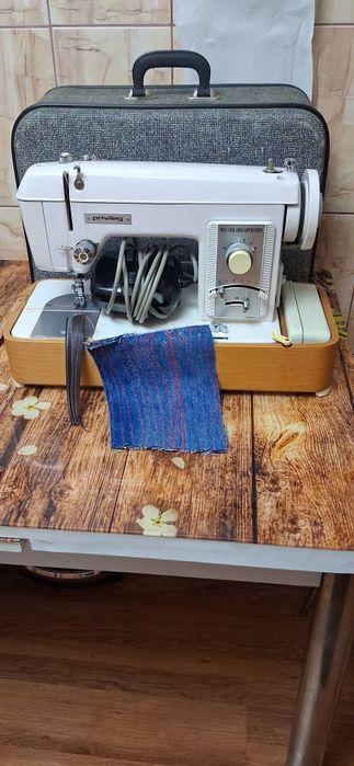 Masina de cusut privileag