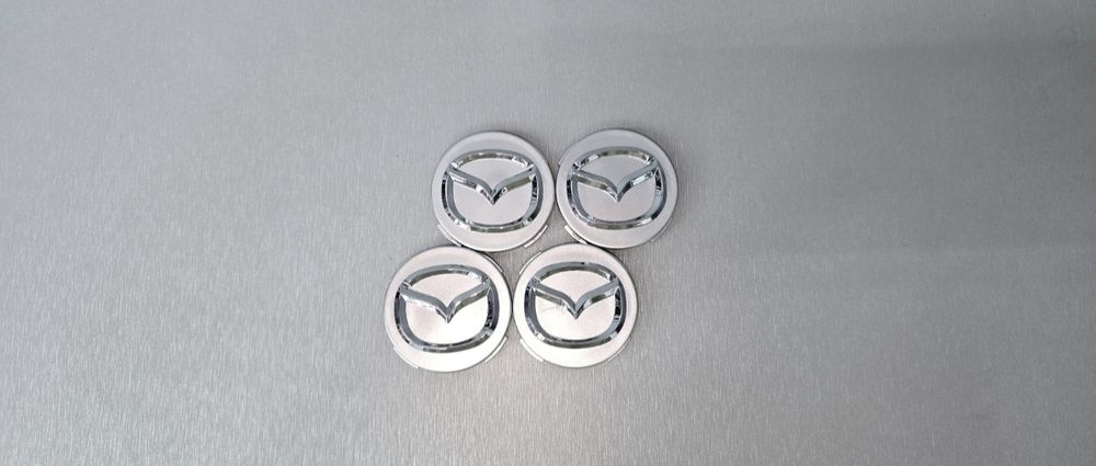 Капачки за джанти Мазда/Mazda 56мм
Чисто