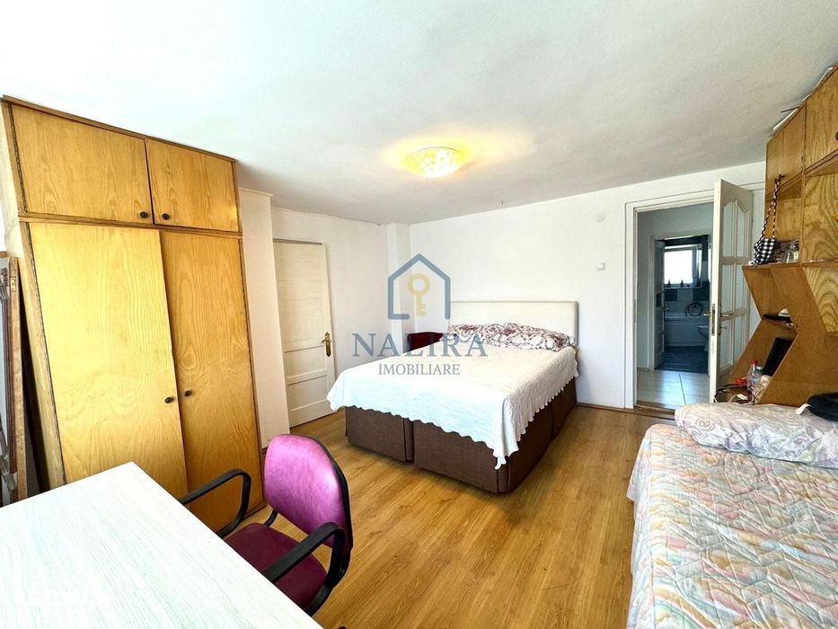 Casa de caramida de vanzare Surdesti cu teren intravilan 5000mp