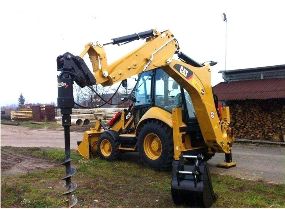 Экскаватор-погрузчик три в одном. Экскаватор-погрузчик.