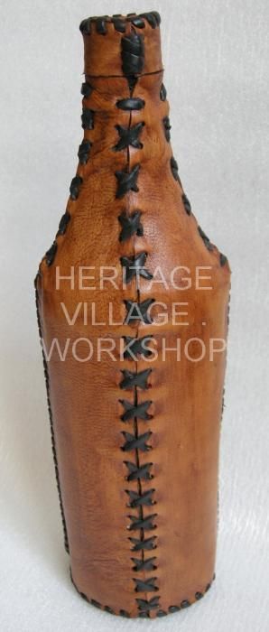 Бутылки сувенирные декорированные кожей.