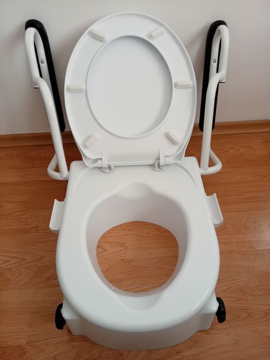 Повдигаща седалка за тоалетна с дръжки