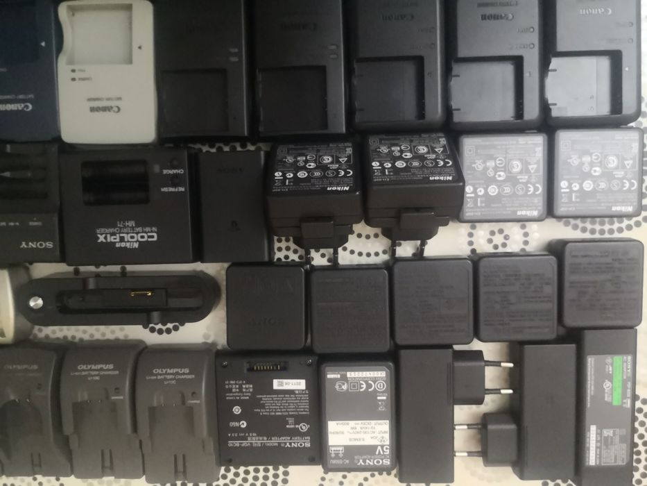 Canon. Sony. Casio. Nikon. Sanio. Olimpus. Kodak. Зарядки  для батарей