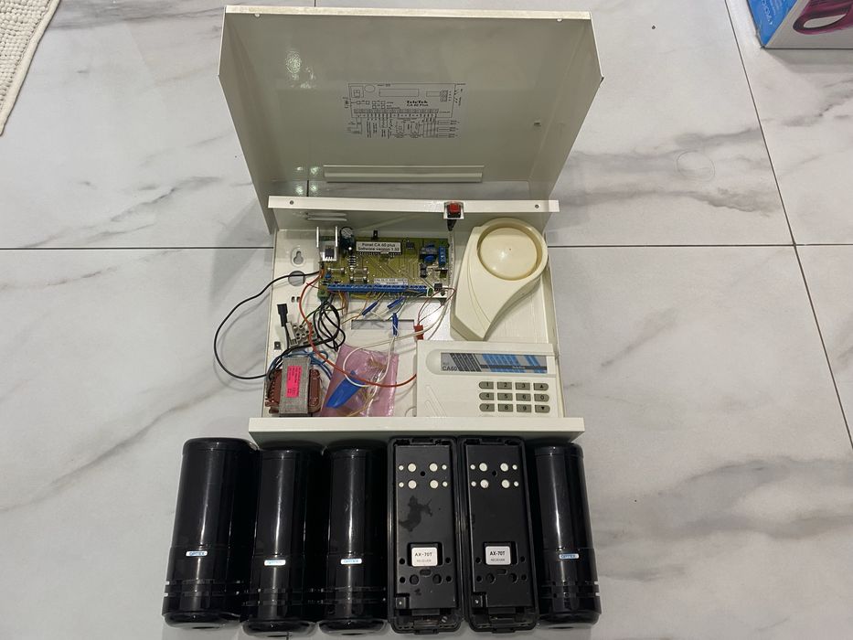 OPTEX – външни периметрови бариери + TeleTek СОТ централа