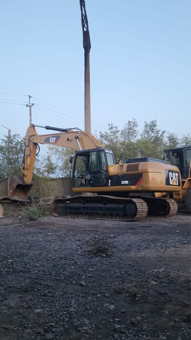 Услуги погрузчика/экскаватора/самосвала