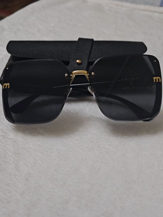 Солнцезащитные очки  Miu Miu (Миу Миу)
