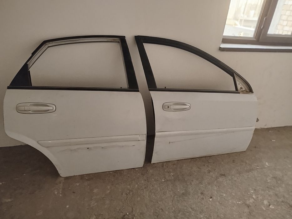 Ласетти эшик ойналари .резиналари хам бор