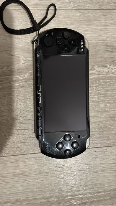 PSP Sony + încărcător original + 2 jocuri+ husa de protectie