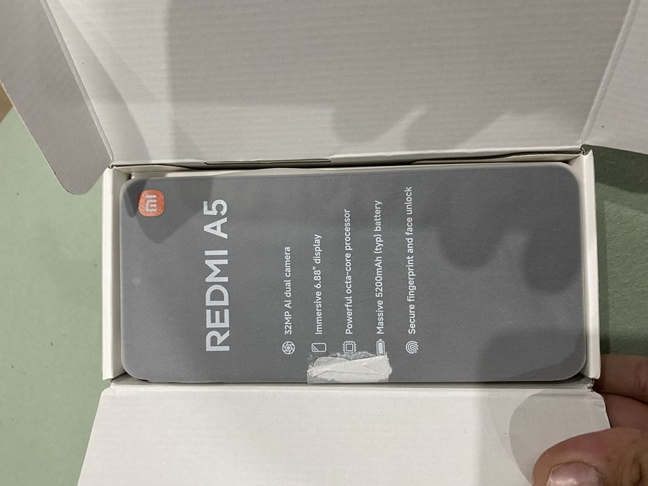 Xiaomi Redmi A5.     V