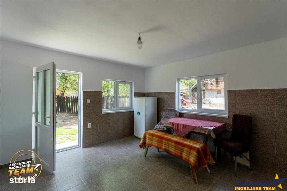 1.200mp teren si casa cu gradina inflorata, aproape de Targu Secuiesc: