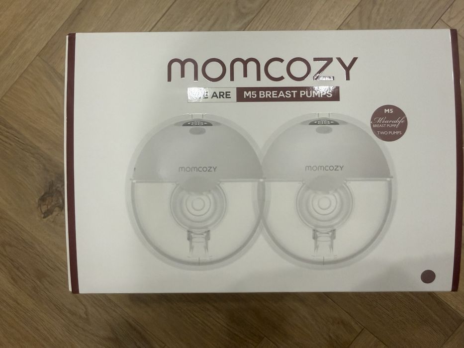 Продам автоматический молокоотсос Momcozy