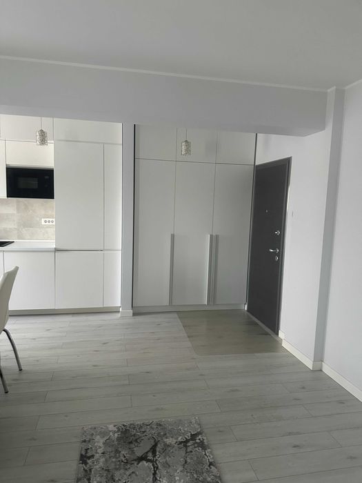 Ofer  spre inchiriere  apartament cu loc parcare si boxa demisol incluse
