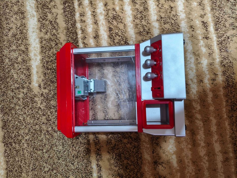 Aparat cu gheara pentru prins bomboane si jucarii rosu