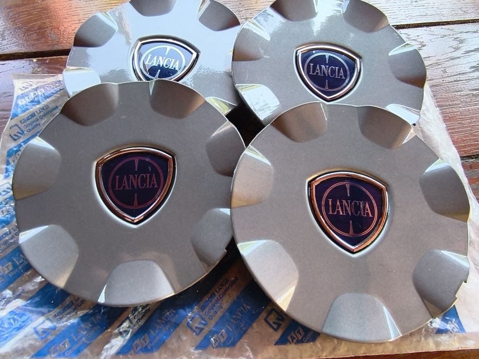 Set 4 capace centrale jante aliaj  Lancia (Delta,  Ypsilon)