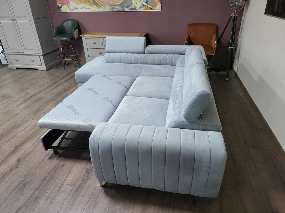 ПРОМОЦИЯ! Светло син ъглов диван от плат с функция сън и ракла