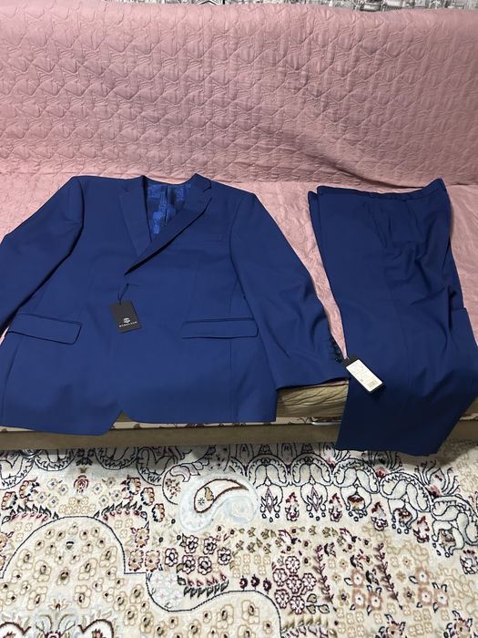 Продам новый костюм