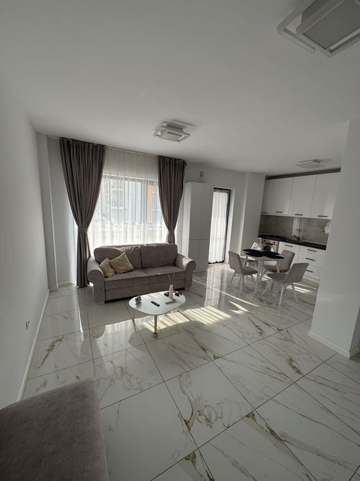 Apartament deluxe pentru inchiriere cu două camere și terasă în Giroc, modern, spațios, complet mobilat, ideal pentru confort și relaxare.