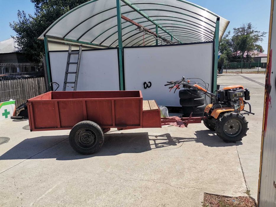 Motocultor O'MAC MC 12000E-D echipat cu remorca foarte incapatoare cu frana de picior
