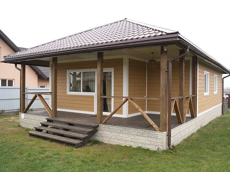 Сайдинг Карьяла под дерево. Металлочерепица, софиты, водосток.