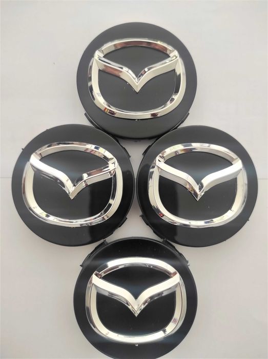 Капачки за Джанти за МАЗДА 56 мм. Цвят: Сребристи, червени и черни.