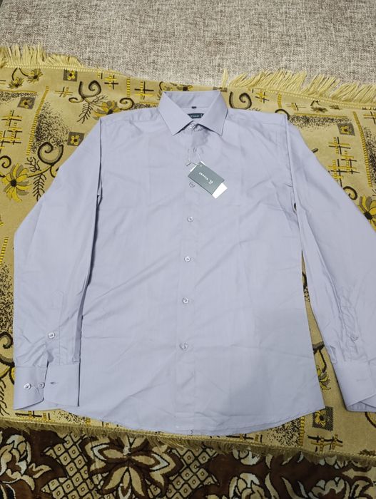 Продам новые брюки ,рубашки,костюм