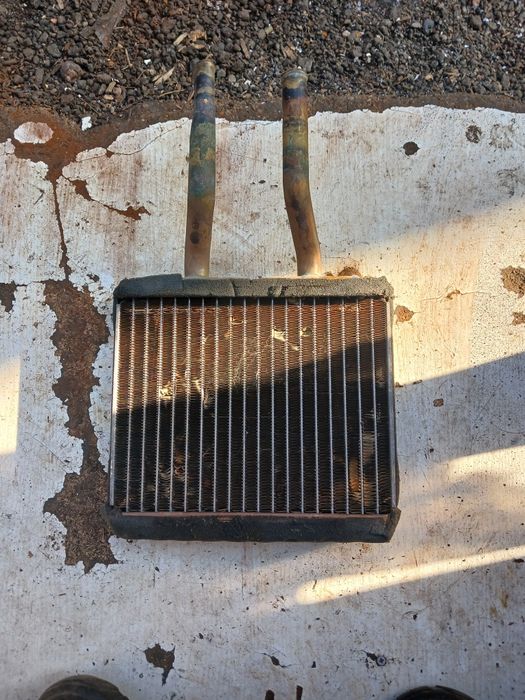 Радиатор печки Мазда 121