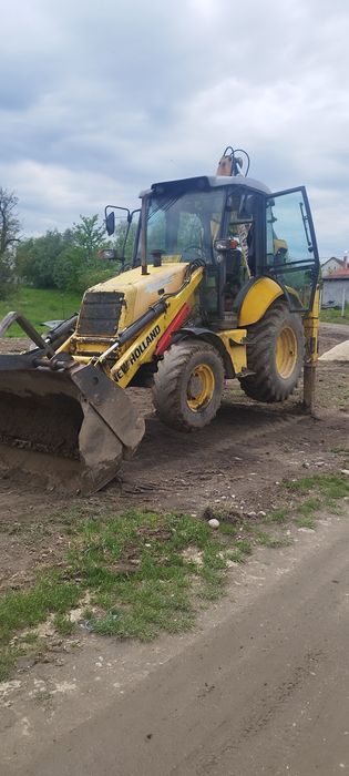 Execut lucrări de săpătură buldoexcavator new Holland lb95b