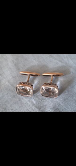 Серебряные запонки.