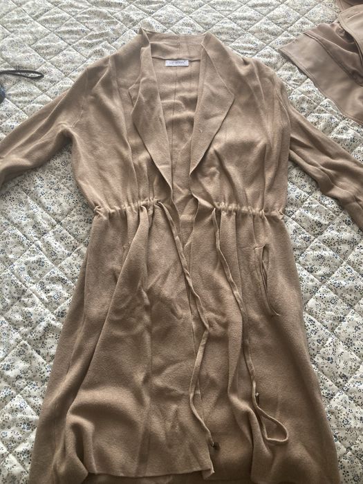 Жилетка, не е носена.