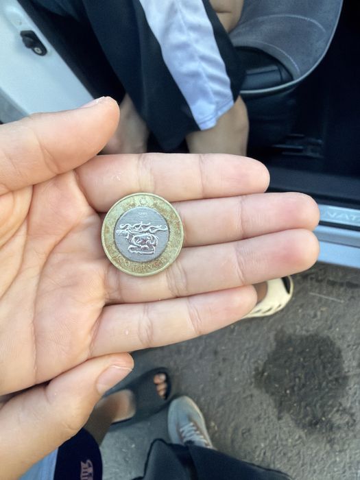 монета наминалом 100 тг