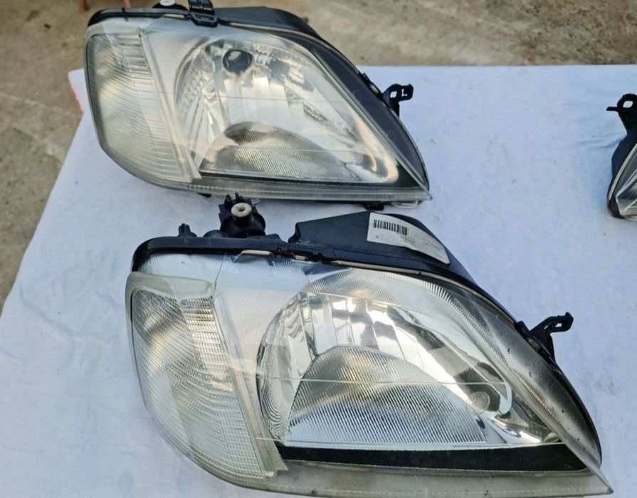 Faruri logan originale Elba (faza 1 ) și lampă spate