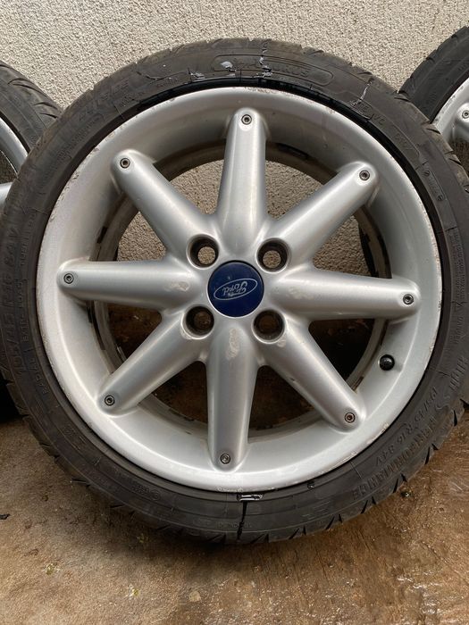 Jante originale Ford 16" 4x108 (8 spițe) + Anvelope Taurus 195/45 R16 (DOT 2025 / 2021)