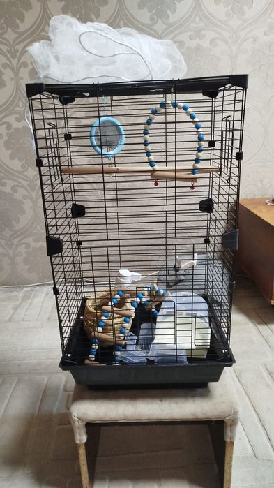 Продам клетку для попугая с игрушками