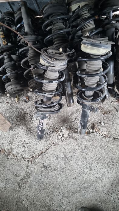 Amortiizor stanga față cu arc si flansa cu rulment renault scenic 2