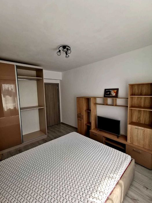 Apartament doua camere cu loc de parcare si curte proprii