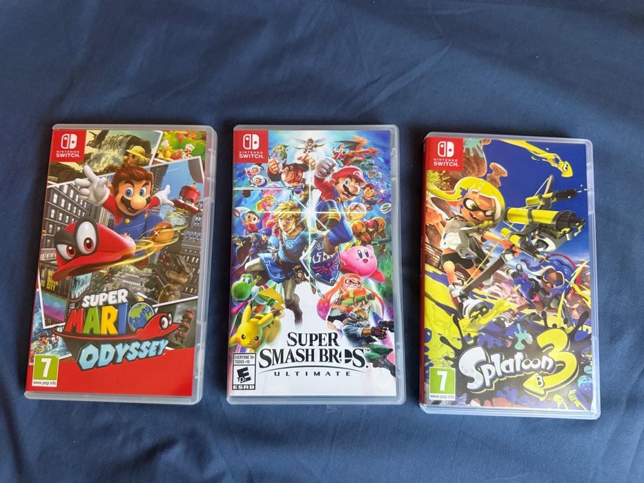 Nintendo Switch OLED – Mario Red Edition + 3 jocuri
