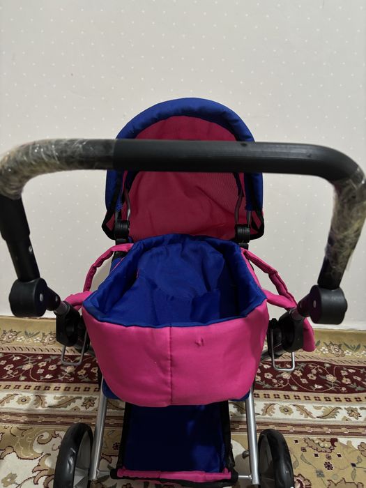 Игрушечная коляска розовая