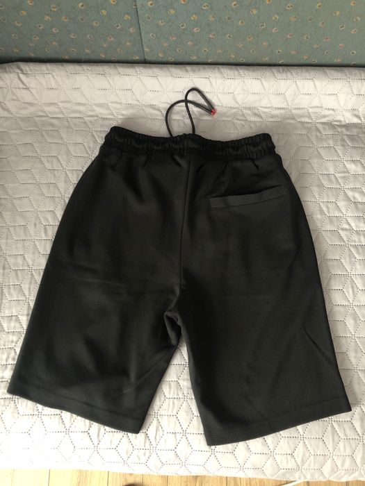 Pantaloni surti Prada