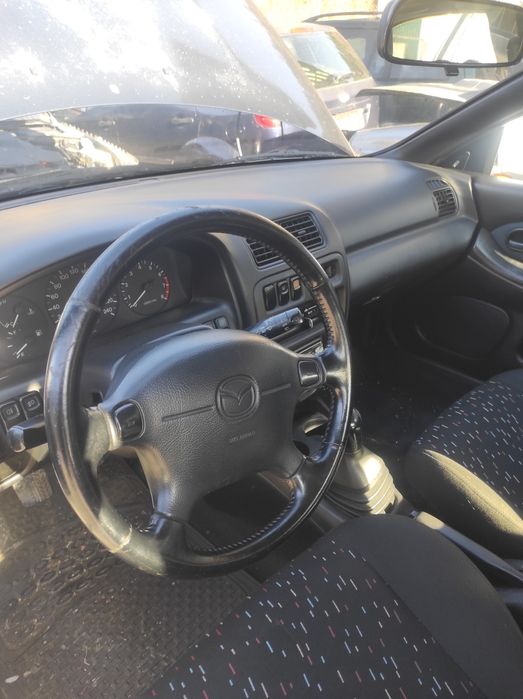 Мазда 323 бензин на части