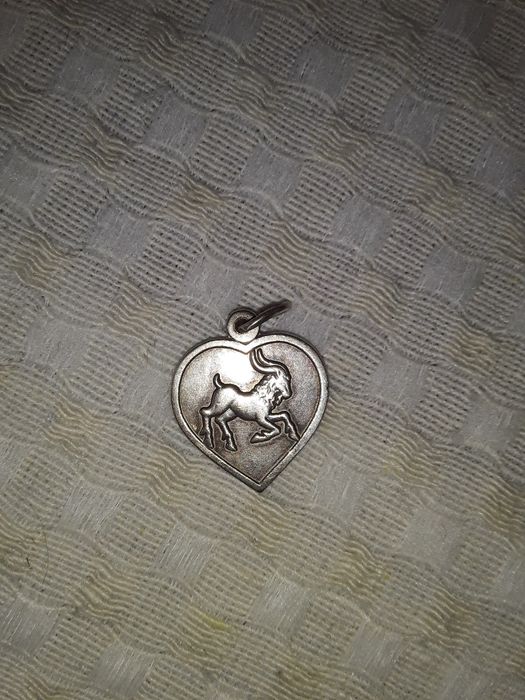 Кулон серебро козерог