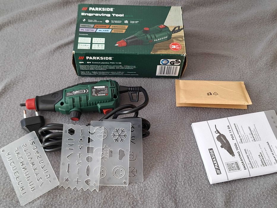 Aparat de gravură Parkside (model PGG 15 G6), destinată gravării pe diverse materiale precum metal, piatră, ceramică, plastic, sticlă și lemn