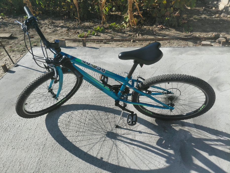 Vand bicicleta aproape noua