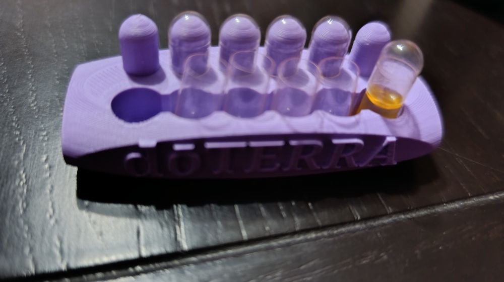 Dispozitiv pentru umplerea capsulelor doTERRA