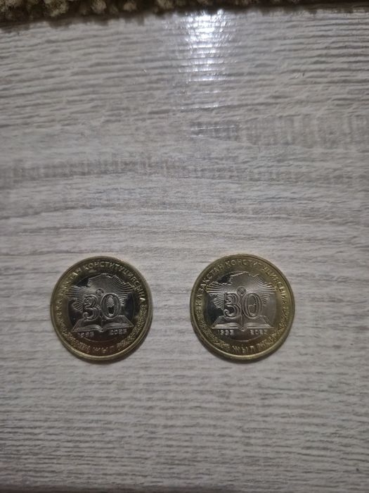 100 теңге (30 жыл) симвлолымен